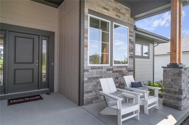 view of exterior entry featuring stone siding