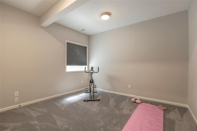 workout area featuring carpet floors, visible vents, and baseboards