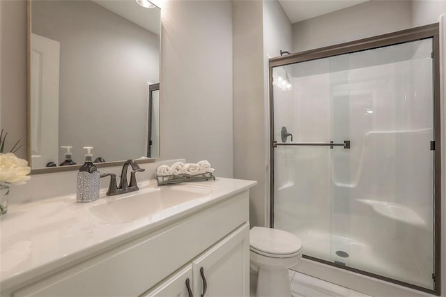 full bath featuring toilet, a shower stall, and vanity