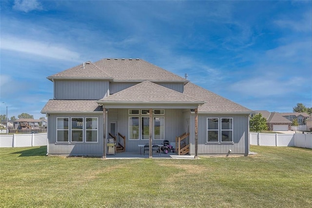 back of property featuring a patio area, a fenced backyard, and a lawn