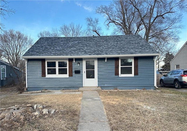 view of front of house featuring roof with shingles