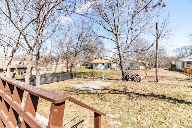 view of yard with a residential view and fence