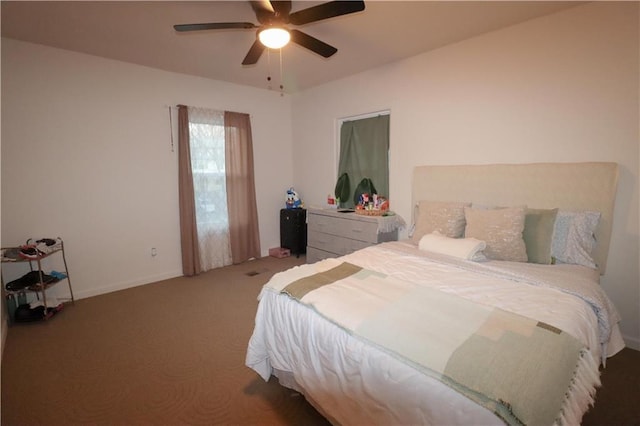 carpeted bedroom with a ceiling fan and baseboards