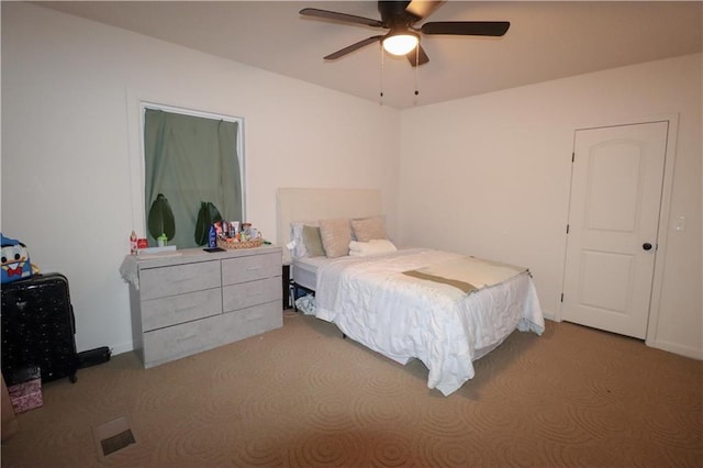 carpeted bedroom with baseboards