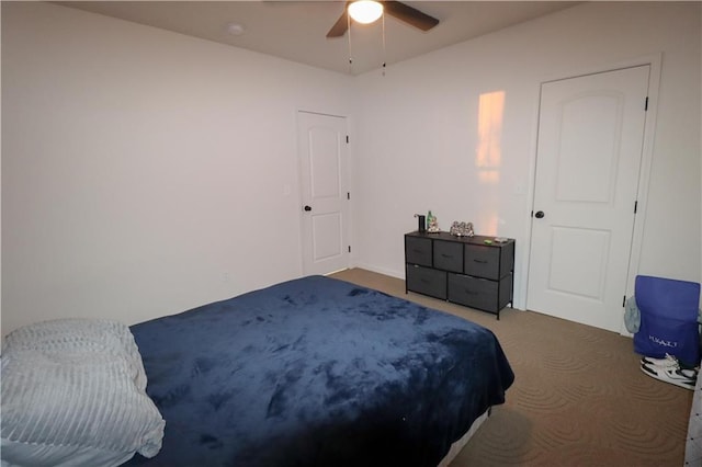 carpeted bedroom featuring a ceiling fan