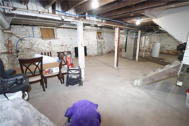 unfinished basement with water heater and heating unit