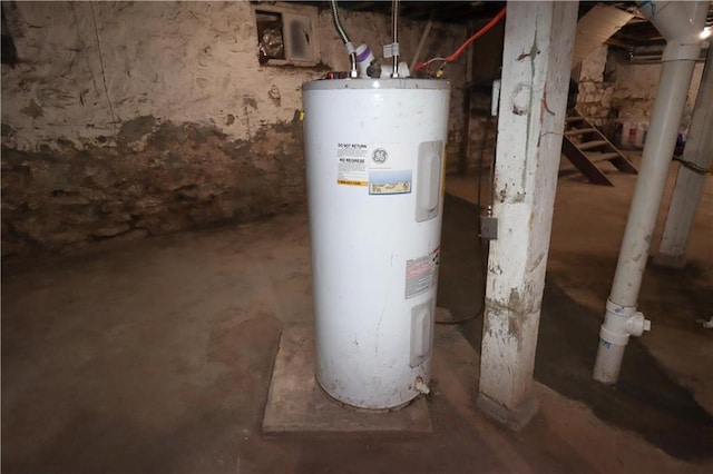 utility room featuring water heater