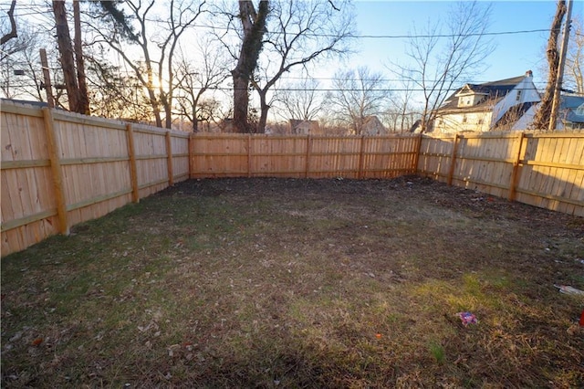 view of yard featuring a fenced backyard