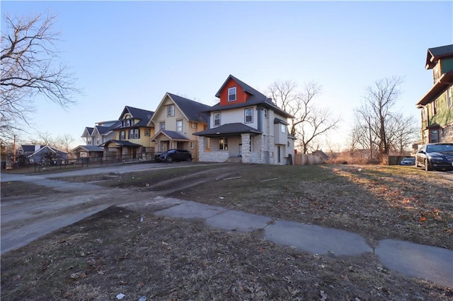 view of front of property with stone siding and a residential view