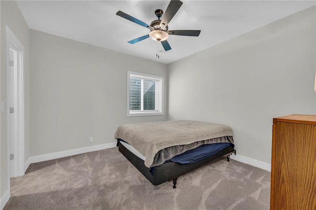 bedroom featuring a ceiling fan, baseboards, and carpet floors