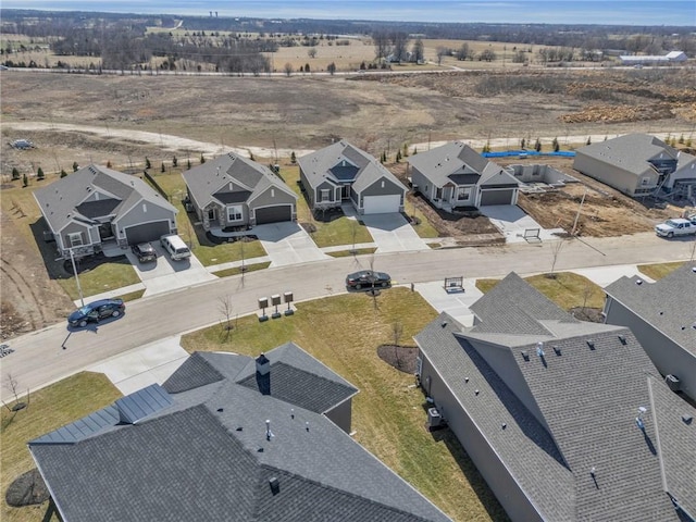 birds eye view of property with a residential view