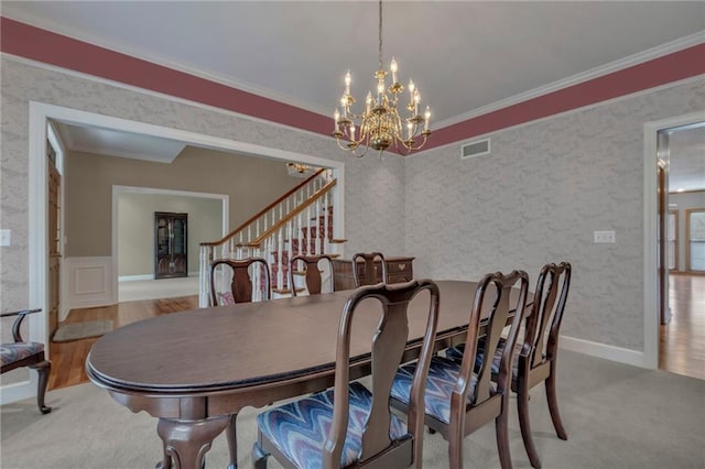 dining room with visible vents, ornamental molding, stairs, and wallpapered walls