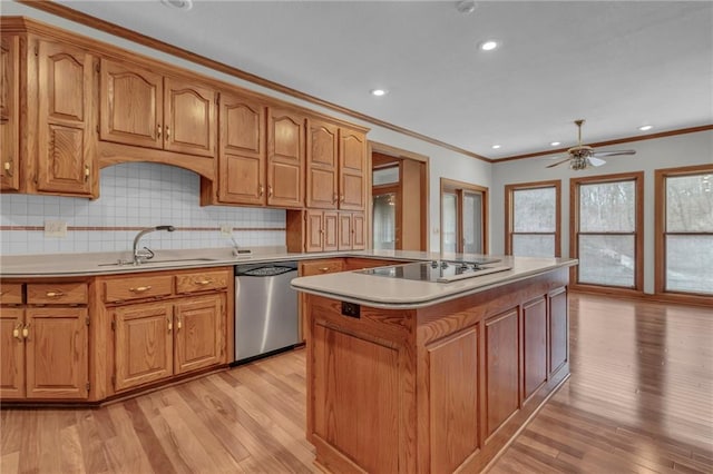 kitchen featuring light wood-style flooring, a sink, light countertops, black electric stovetop, and dishwasher