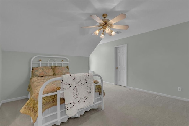 carpeted bedroom featuring visible vents, a ceiling fan, lofted ceiling, and baseboards