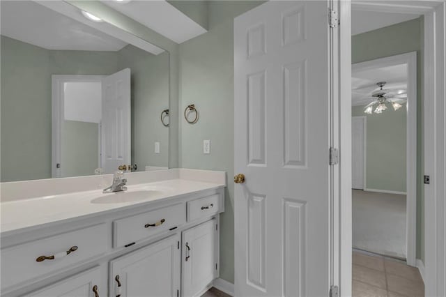 bathroom featuring vanity, tile patterned floors, and baseboards