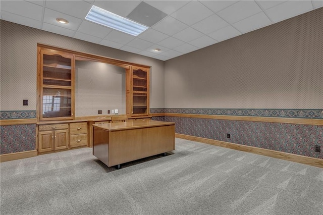 office space featuring light carpet, wallpapered walls, and baseboards