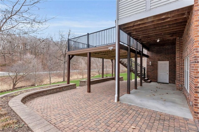 view of patio / terrace featuring stairway and a wooden deck