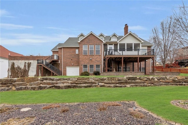 rear view of property with brick siding, stairway, a chimney, a yard, and a sunroom