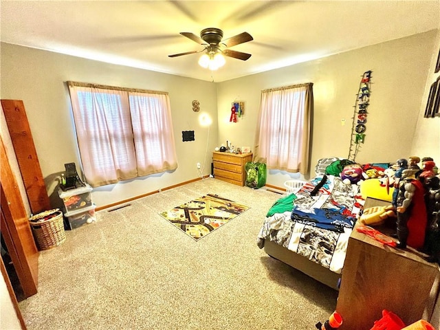 bedroom with multiple windows, carpet flooring, visible vents, and baseboards