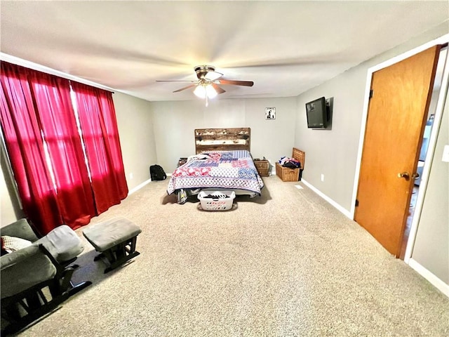 bedroom with carpet floors and baseboards