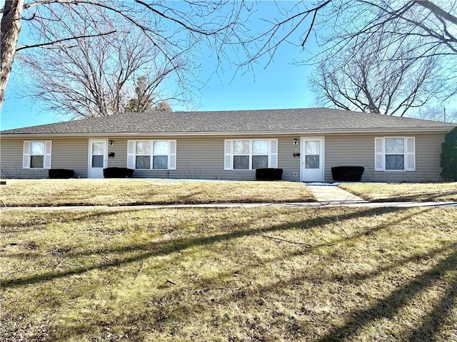 ranch-style house featuring a front lawn