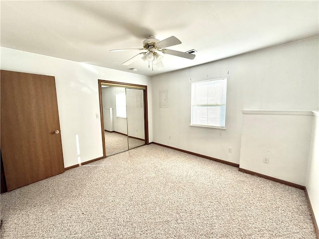 unfurnished bedroom featuring a ceiling fan, a closet, visible vents, and baseboards