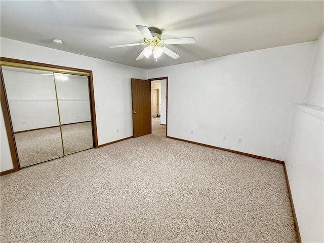 unfurnished bedroom with a closet, a ceiling fan, and baseboards