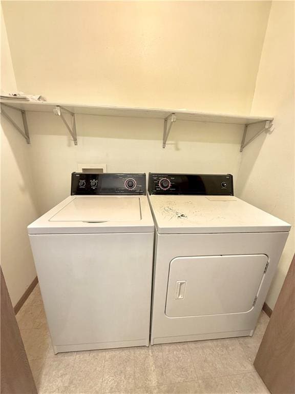 laundry room featuring washer and dryer and laundry area