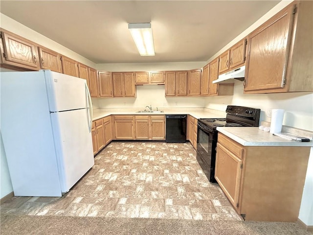 kitchen with light countertops, a sink, under cabinet range hood, and black appliances