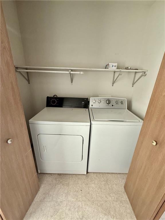 laundry room with laundry area and washing machine and clothes dryer