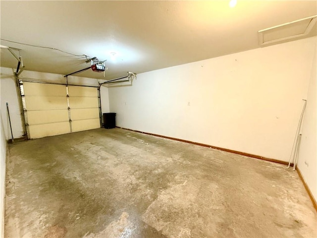 garage featuring baseboards and a garage door opener