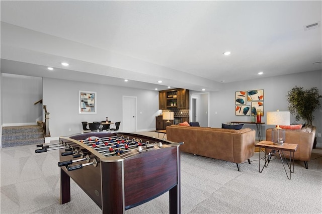 recreation room featuring recessed lighting, visible vents, baseboards, and light colored carpet