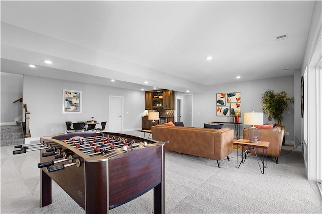 rec room with recessed lighting, visible vents, baseboards, and light colored carpet