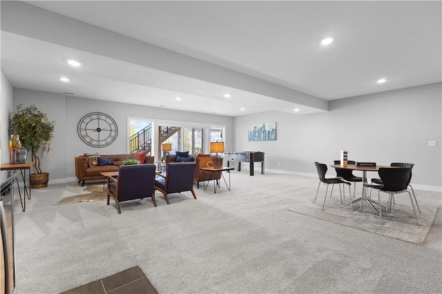 carpeted dining room with recessed lighting and baseboards