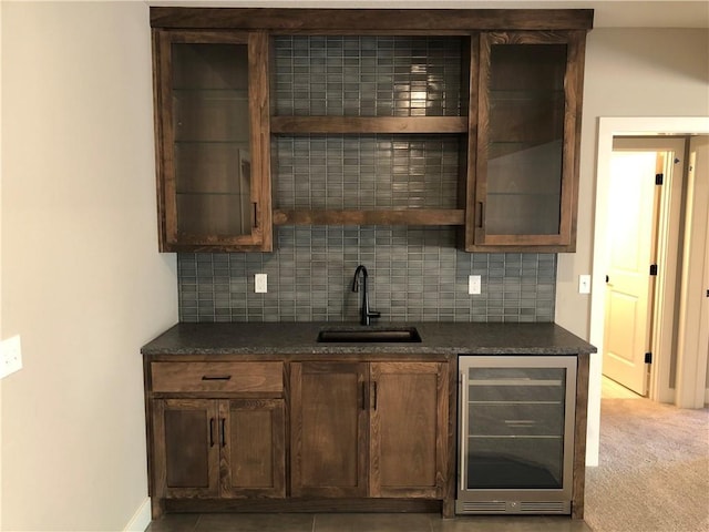 bar featuring decorative backsplash, a sink, and wine cooler