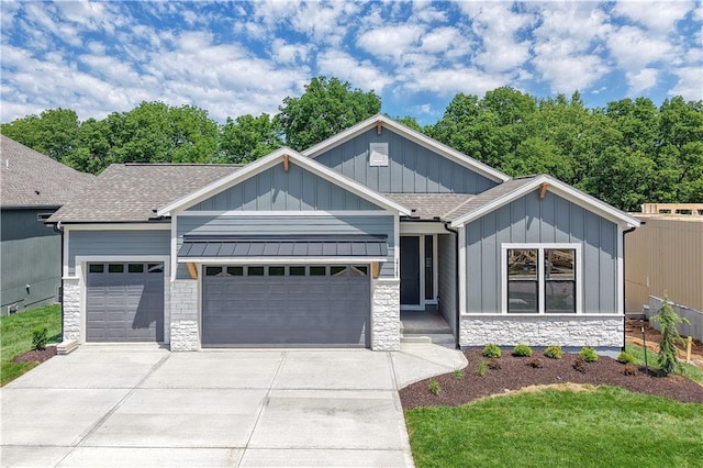 17147 S Heatherwood St, Olathe, KS 66062 - view of front facade with stone siding, board and batten siding, an attached garage, and driveway