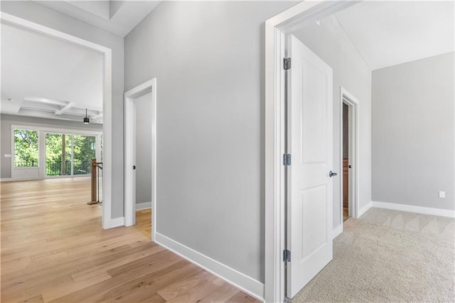 17147 S Heatherwood St, Olathe, KS 66062 - corridor with baseboards, coffered ceiling, light wood-style flooring, and beamed ceiling