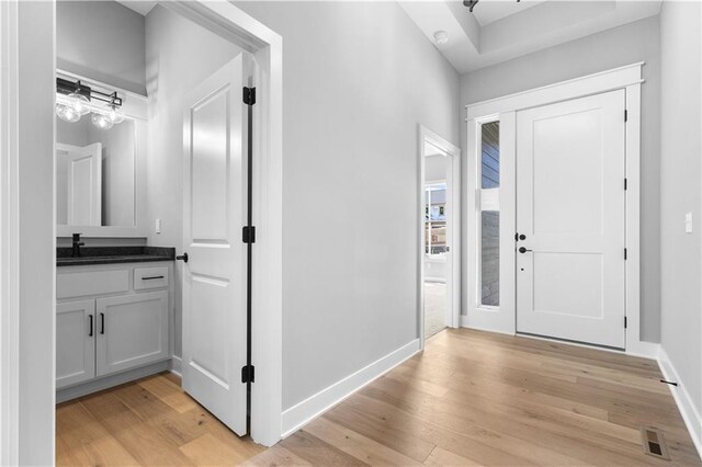 17147 S Heatherwood St, Olathe, KS 66062 - foyer with light wood-style flooring and baseboards