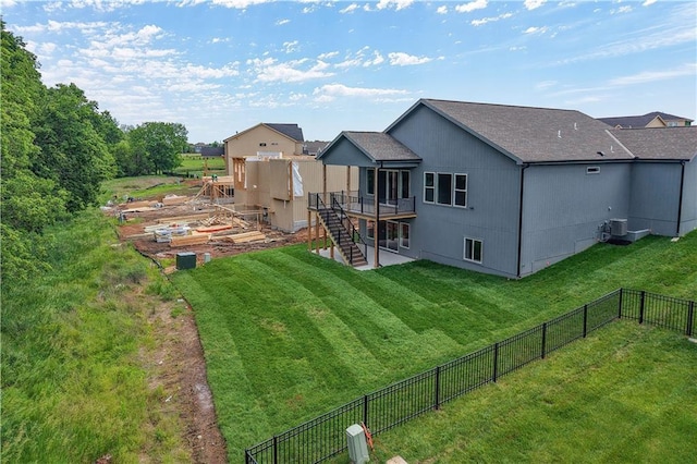 17147 S Heatherwood St, Olathe, KS 66062 - back of property featuring stairway, a wooden deck, and central AC