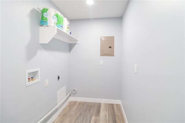 clothes washing area featuring hookup for a washing machine, hookup for an electric dryer, light wood-type flooring, laundry area, and electric panel