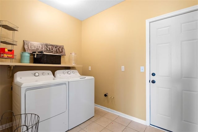 15498 Cedar Ln, Basehor, KS 66007 - laundry room with washing machine and clothes dryer and light tile patterned floors