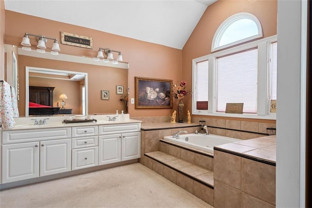15498 Cedar Ln, Basehor, KS 66007 - full bathroom featuring double vanity, lofted ceiling, and a garden tub
