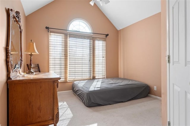 15498 Cedar Ln, Basehor, KS 66007 - carpeted bedroom with vaulted ceiling and baseboards