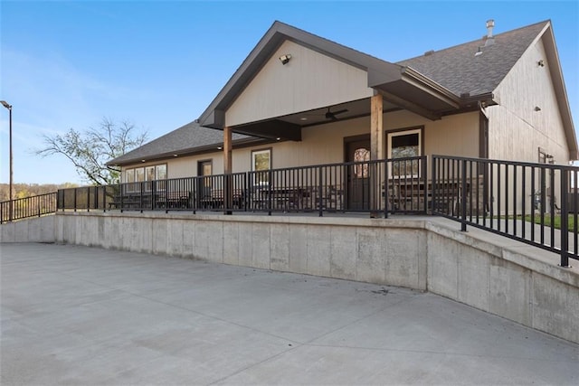 15498 Cedar Ln, Basehor, KS 66007 - back of property featuring a shingled roof and a patio area