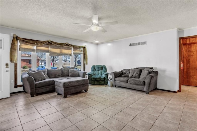 living room with visible vents, a ceiling fan, a textured ceiling, crown molding, and light tile patterned flooring