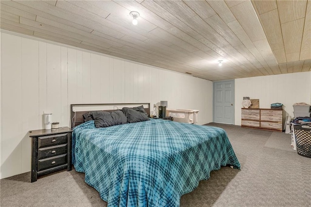 bedroom with wooden ceiling and carpet flooring