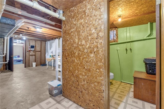 unfinished basement featuring tile patterned floors