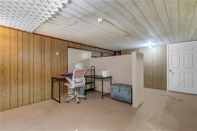 office with wood walls and concrete floors