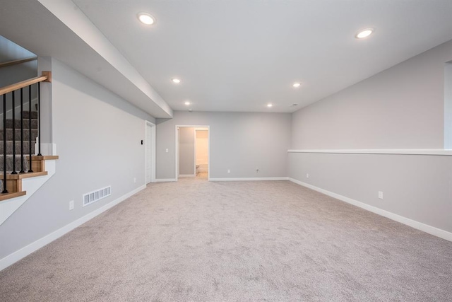 interior space featuring stairway, baseboards, visible vents, and recessed lighting