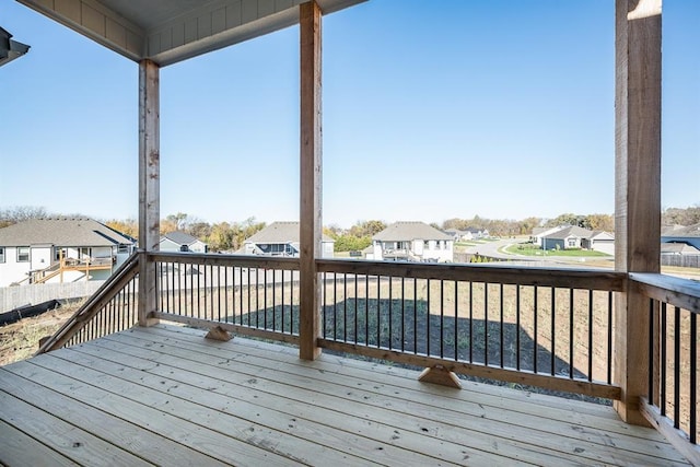 wooden deck featuring a residential view